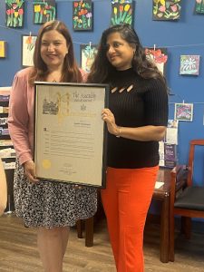Dr. Sujatha Ramanujan recieving 2024 Woman of Distinction Award