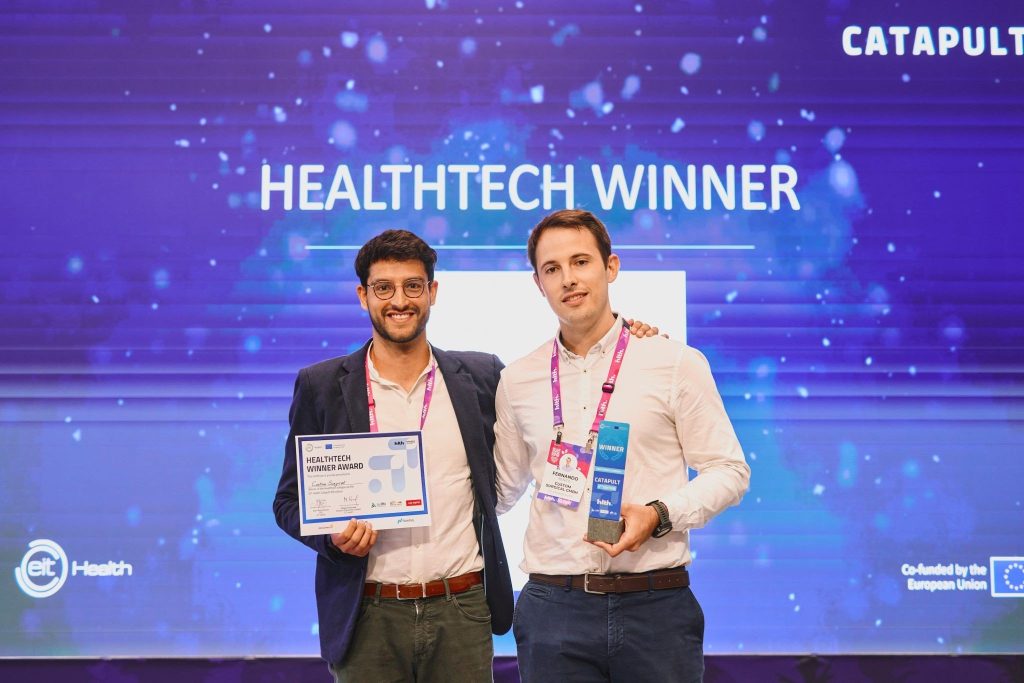 Custom Surgical posing with award