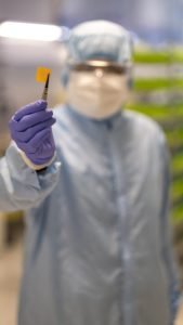 Metahelios CTO, Yash Shah, holding up a metafilter chip